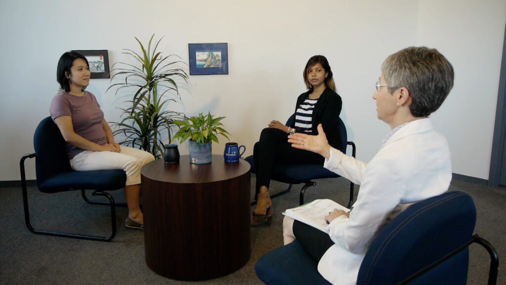 three women in an office setting in the midst of demonstrating simulation learning. 