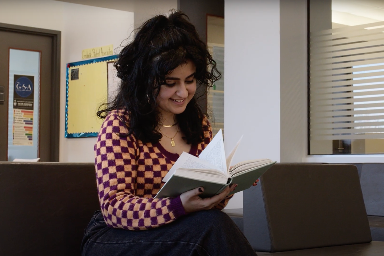 Social Work student Areeka Riaz reading in the student lounge
