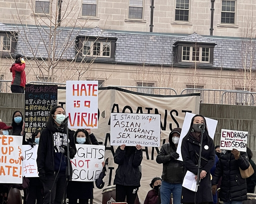 Toronto Solidarity Rally Against Anti-Asian Hate. After the Atlanta Spa Mass Shootings on March 16, 2021, CCNCTO and other Asian-Canadian communities organized a rally at the Nathan Philips Square (Toronto City Hall) on March 28, 2021, to raise awareness about anti- Asian racism. Hundreds of supporters and allies gathered for the cause. At the microphones Jessie Tang (left) and Kennes Lin (right), both of CCNCTO. (Photo by Izumi Sakamoto)