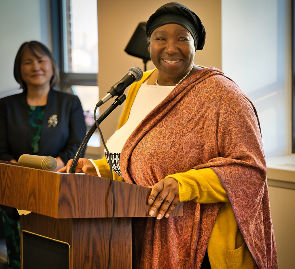 Photo of Andria Allen, FIFSW Alumni Association President. Speaking at FIFSW's Fall 2022 convocation reception at 246 Bloor Street West