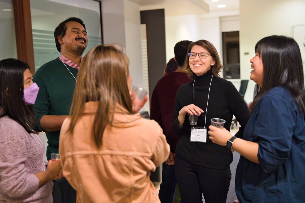 Students and alumni in conversation at an alumni mentorship program event.