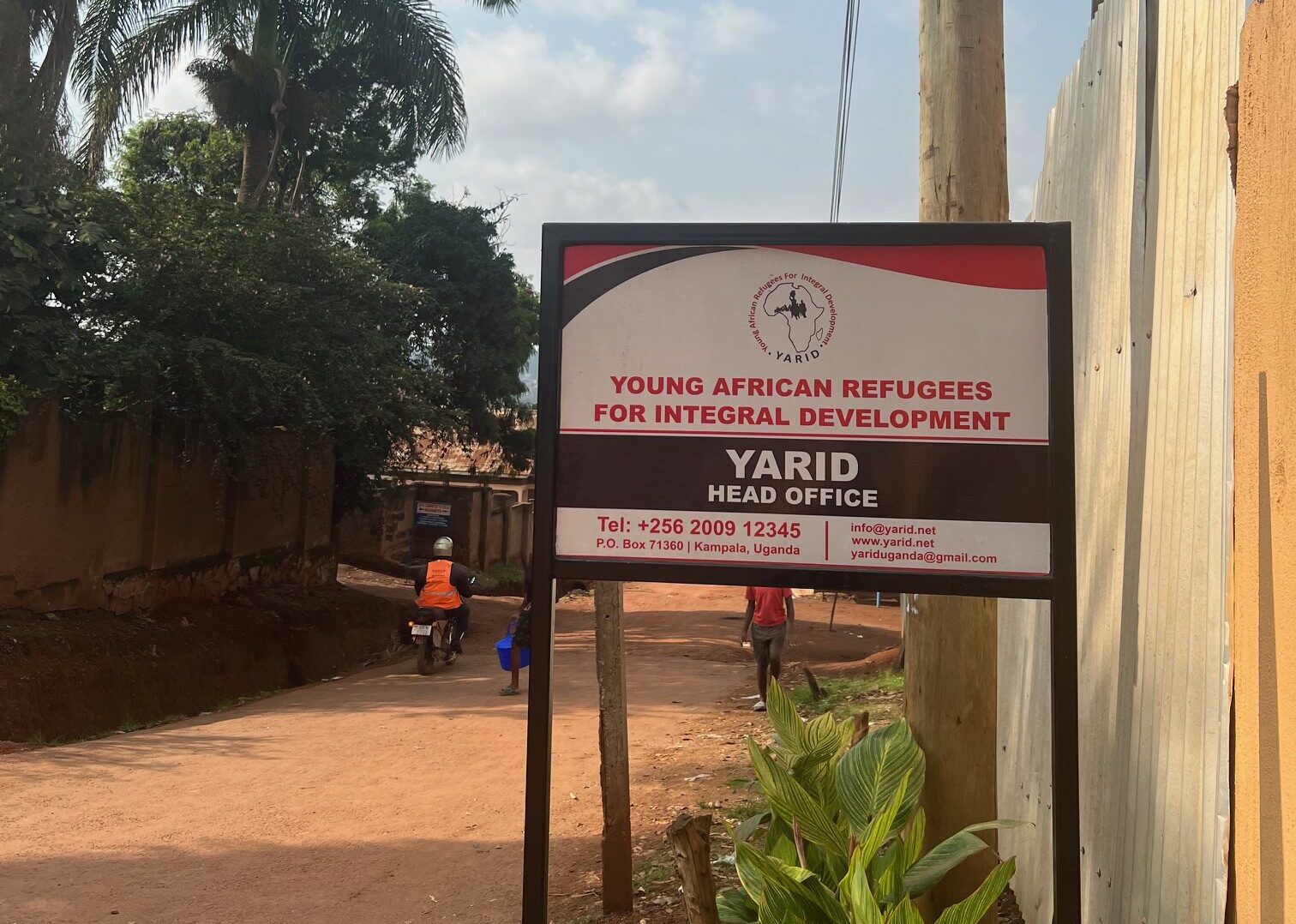 Sign along a road in Kampala, Uganda that reads: Young African Refugees for Integral Development, YARID Head Office