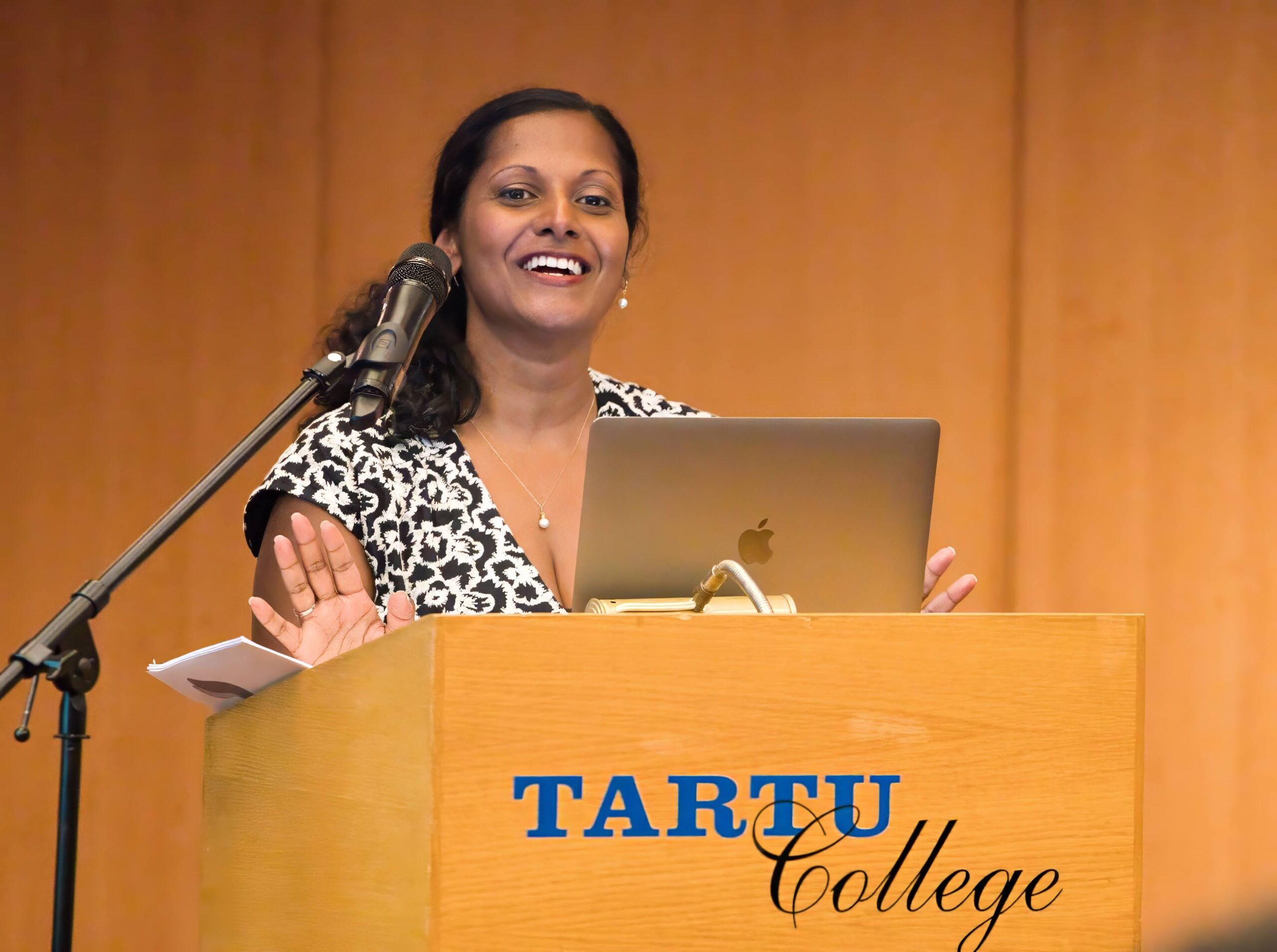 Uppala Chandrasekera speaking at a podium