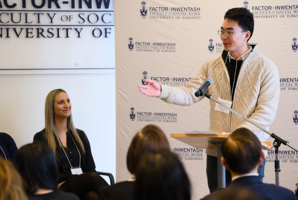 Noah Yan speaking at an event