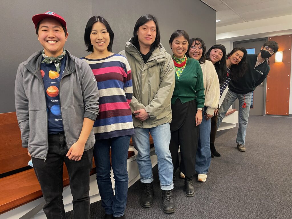 Izumi Sakamoto poses for a photo with 7 members of her research team