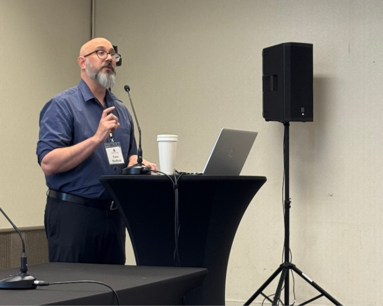Peter Sheffield presenting in at a conference