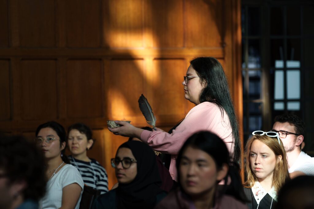 Woman conducting a smudging ceremony at Hart House