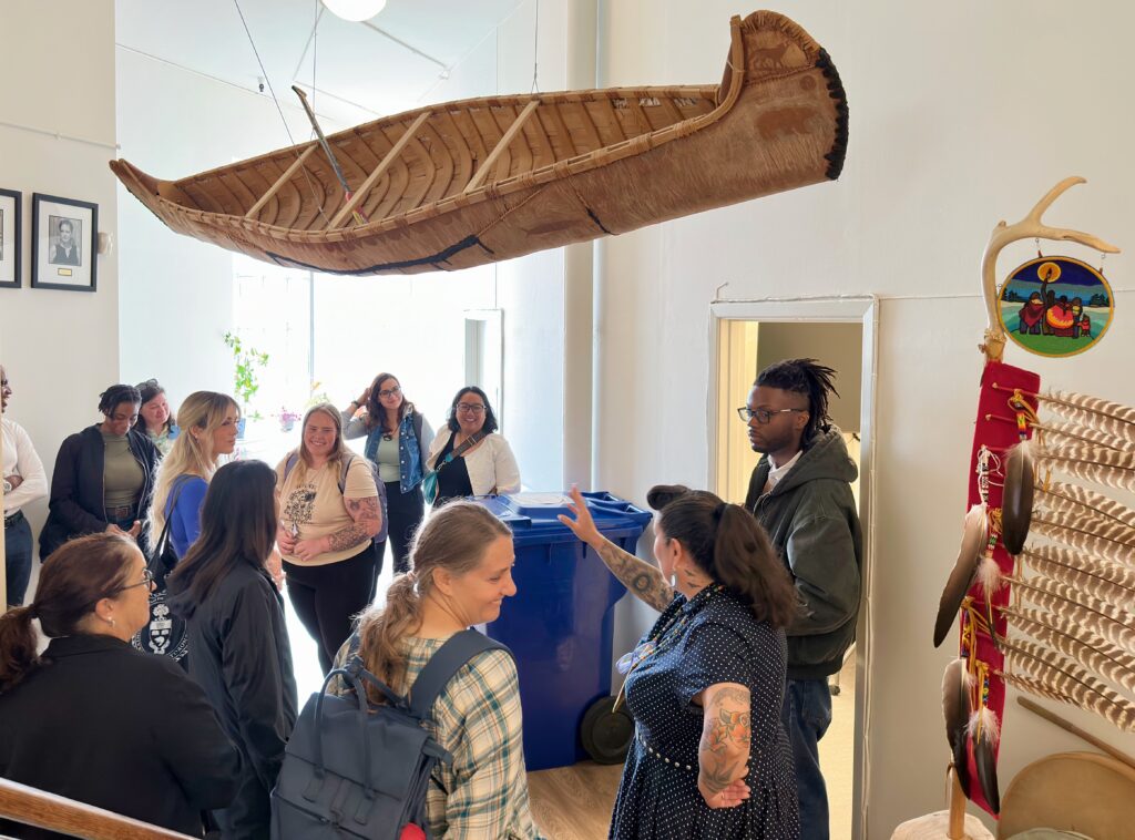 students, faculty and staff visit first nations house.